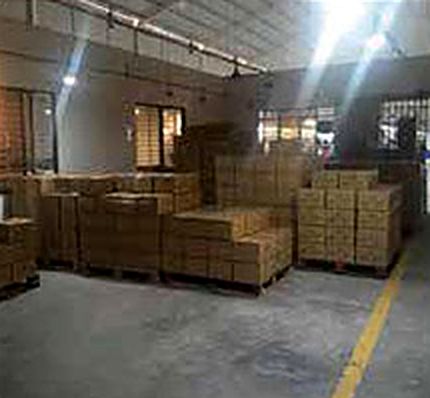 Packed cartons stacked in a warehouse, ready to ship