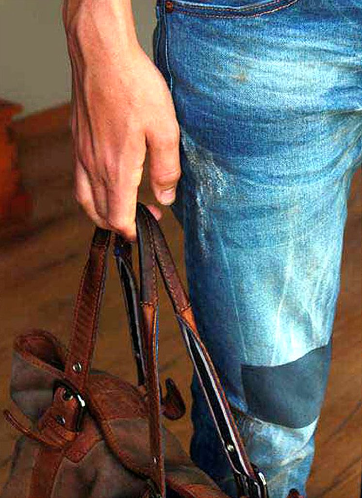 Light blue jeans with a darker patch at the knee